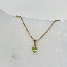 Materials: 14k Yellow Gold Gemstone: Natural Peridot Total Peridot Carat Weight: 0.28 ct. Peridot Diameter: 5mm x 3.7mm Description: This listing is for the pendant only, the necklace is not included. These are natural peridot, these are not lab grown gemstones. This beautiful piece will not tarnish in the shower and will not irritate the skin. It will arrive in a jewelry box, with a jewelry bag for traveling. Perfect for gift giving! Feel free to message me with any questions! Gift Yellow Gold Peridot Gemstones, Peridot Pendant, Sapphire Studs, Jewelry Bag, Jewelry Bags, Pink Sapphire, Heart Pendant, Lab Grown, Arrow Necklace