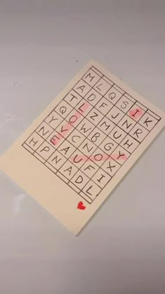 a piece of paper that has some type of writing on it with red hearts in the middle