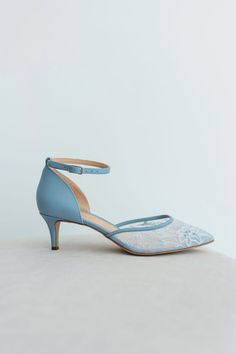 a woman's blue high heeled shoe with an open toe and ankle strap