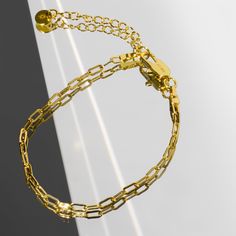 Our Paperclip bracelet is a golden staple to wear alone or stack with our other gold filled bracelets. Our 14k gold-filled jewelry is bonded with 14k gold and is water and tarnish resistant. 14k gold-filled jewelry is a great alternative to solid gold, and can be worn by people with sensitive skin. The color will not tarnish but recommend to keep away from perfumes and lotions. - 14k gold-filled- Chain width: 3.5 mm.- Chain length: 6"- Water resistant / Tarnish resistant / Hypoallergenic Adjustable 14k Gold-filled Paperclip Chain Bracelet, Gold Bracelet With Rectangular Cable Chain Links, Adjustable Gold-tone Paperclip Bracelet For Everyday, Minimalist Gold Plated Cable Chain Bracelet, Everyday Gold Bracelets Tarnish Resistant, Gold Plated Bracelets With Paperclip Chain, Gold-plated Paperclip Chain Bracelet, Gold Minimalist Paperclip Bracelet With Oval Links, Gold Minimalist Oval Link Paperclip Bracelet