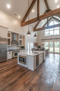 Contemporary barndominium interior with neutral color palette, minimalist fixtures, and cozy living area with farmhouse elements