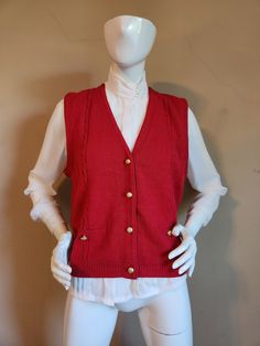 Good vintage condition  Marked size medium  Measurements  Shoulders 14 Chest 40 CB 21 deep red color Sag Harbor acrylic Classic Red Vest For Fall, Knit Button Sweater Vest For Fall, Knit Sweater Vest With Buttons For Fall, Classic Red Winter Vest, Vintage Red Sweater Vest For Fall, Classic Sweater Vest With Button Closure For Fall, Red Vintage Sweater Vest For Fall, Fitted Red Sweater Vest For Winter, Vintage V-neck Sweater Vest For Winter