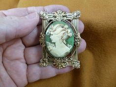 Lady with hair up flower green + ivory oval Cameo scrolled leaf brass pin pendant brooch cm44-24 Pine Resin, Victorian Brass, Silver Brooch Pin, Pendant Brooch, Nugget Necklace, Brass Pin, Cameo Jewelry, Flower Green, Hand Molding