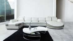 a modern living room with black and white furniture