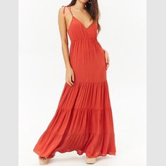 A Woven Maxi Dress Featuring A V-Neckline, Self-Tie Cami Straps, An Elasticized Waist, Shirred Tiered Seams, And A Flounce Hem. - 100% Rayon - Hand Wash Cold Red V-neck Maxi Dress With Tie Back, Red Tie Back Maxi Dress For Brunch, Red V-neck Dress With Tie Back, Red Lace Maxi Dress, Orange Bridesmaid Dresses, Solid Maxi Dress, Yoke Dress, Tie Maxi Dress, Cami Maxi Dress