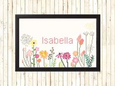 a cross stitch pattern with flowers and the word'isabela'in it