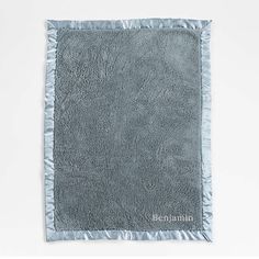 a gray towel with the name benna on it and a blue border around it