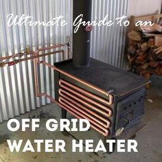 an old fashioned stove sitting next to a pile of firewood in front of a metal wall