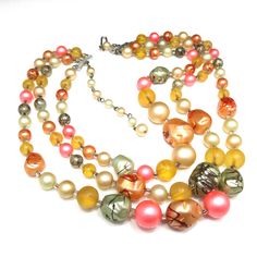 *Description: This is a beautiful Japan necklace which has a variety of multicolored round glass beads with accent art beads which have been hand painted so no two are alike. The necklace also has small bugle beads as spacers, from the 1950s. Japan necklaces have very unique and artistic bead accents. Each one is a beautiful piece of art and no two are alike. This would be a great addition to your vintage jewelry collection or make a great vintage gift! *Approximate Measurements: Length - 17 Inc Accent Art, Necklace Art, Bugle Beads, 1950s Vintage, Bead Art, Vintage Gifts, Round Glass, Glass Beads, Jewelry Collection