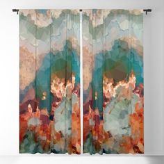 a window curtain with an abstract painting on it