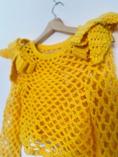 Handmade crochet sweater yellow. Bow shoulders. Mesh crochet. Size S. Yellow Crochet Top With Crochet Trim For Spring, Spring Yellow Crochet Top With Crochet Trim, Yellow Knit Sweater For Spring, Casual Yellow Crochet Sweater, Spring Yellow Knit Sweater, Hand Knitted Yellow Sweater For Spring, Yellow Crochet Knit Tops, Yellow Crochet Long Sleeve Sweater, Yellow Knit Crochet Top For Spring