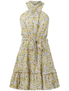 This floral mini dress will make you stand out at any summertime event. Its halter neckline and vibrant yellow color add a playful touch, while its lightweight fabric keeps you cool and comfortable. Perfect for making a statement without taking yourself too seriously. Size Guide: Demi is 5’65” tall, and has a 33.6” bust, 24.1” waist, & 35.2” hips. She is wearing a S / US 4 / AU 8. This dress is true to size. Material: 100% Viscose. Feature: Halter neckline. Sleeveless. Waist tie. Floral prints. Mini length. Relax fit. Care Instructions: Machine wash / Cold hand wash Yellow Floral Dress For Summer Garden Party, Yellow Mini Floral Dress For Summer, Summer Sundress With Lemon Print, Yellow Summer Halter Dress For Vacation, Spring Halter Mini Dress For Summer Parties, Summer Mini Dress With Halter Neck For Spring, Summer Sundress With Lemon Print For Spring, Lemon Print Sundress For Spring, Spring Daytime Dress With Halter Neck