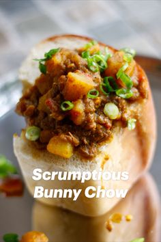 a close up of a sandwich on a plate with the words scrumptious bunny chow