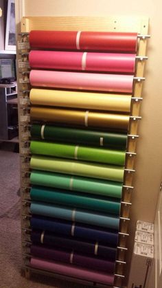 a rack with many different colored papers on it