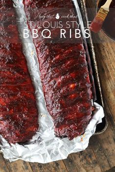 bbq ribs in tin foil with barbecue sauce on the side and ketchup next to them