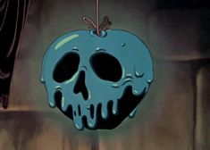 an apple with a skull hanging from it's side