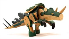 a wooden toy dinosaur with spikes on it's head