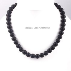 PRODUCT DETAIL :ITEM : MATTE BLACK ONYX BEADED NECKLACEITEM CODE :  DGC2355ITEM NAME :NECKLACEGEMSTONE : BLACK ONYXBEADS SHAPE : ROUNDLENGTH :   19 INCH APPROXBEADS SIZE:  12 MM  ApproxWEIGHT :  470 Cts. APPROXCUSTOMIZATION/BULK ORDER : AVAILABLEPLEASE FEEL FREE TO CONTACT IF YOU REQUIRE ANY FURTHER INFORMATION. Onyx Bead Necklace With 8mm Round Beads, Onyx Bead Necklaces With 8mm Round Beads, Onyx Necklace With 8mm Round Beads, Classic Black Necklaces With 8mm Beads, Black Gemstone Bead Necklaces, Black Gemstone Beads Necklace, Classic Black Beaded Necklaces With Polished Beads, Classic Black Beaded Necklace With Polished Beads, Black Single Strand Necklace