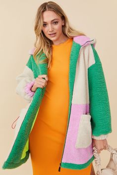 Perfect for the upcoming Spring Season, this faux shearling teddy style jacket is just what your daily wardrobe requires. Featuring a zip-up front and contrasting green, cream, and purple panels, this jacket adds a touch of comfort to your day. This Teddy jacket has a bright lime sweat-wicking lining, it has drawstring elasticated pockets and an oversized fit. We're sure this piece will quickly become one of your go-to items!  Faux Shearling zip Jacket with that perfect multi-toned zip jacket. F Hooded Green Color Block Outerwear, Green Hooded Outerwear With Color Block, Green Hooded Color Block Outerwear, Palette Wardrobe, Teddy Style, Spring Palette, Jacket Cape, Girl Trends, Color Block Jacket