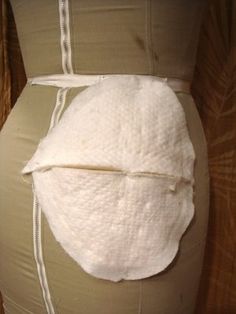 a woman's waist with a piece of white material wrapped around it