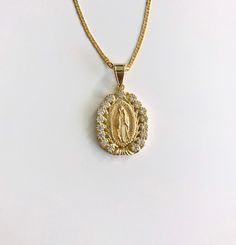 "18K GOLD FILLED GUADALUPE NECKLACE 18\" LONG.. CZ VIRGIN OF GUADALUPE FOR GOOD LUCK ,PROSPERITY AND PROTECTION. PENDANT: 40 x 25 mm 18K GOLD FILLED CADENA DE GUADALUPE 18\" LARGO .. VIRGEN DE GUADALUPE CON ZIRCONIA. PARA PROSPERIDAD, BUENA SUERTE Y PROTECCION. DIJE: 40 x 25 mm" Gold Virgin Mary Pendant Necklace, Gold Our Lady Of Guadalupe Pendant Necklace, Gold Virgin Mary Medallion Jewelry, Gold Our Lady Of Guadalupe Round Pendant Necklace, Gold Medallion Necklace With Our Lady Of Guadalupe, Gold Our Lady Of Guadalupe Necklace Gift, Gold Our Lady Of Guadalupe Medallion Necklace, Gold Medallion Necklace Of Our Lady Of Guadalupe, Gold Our Lady Of Guadalupe Necklace In 14k Gold