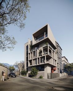 two people are standing in front of an apartment building with balconies on the second floor