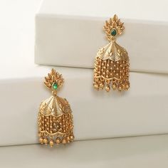 About the Jewelry This leafy designer, Lata jhumkis gives you all the feel of a wedding ceremony. The shower of golden dots makes it much more ravishing and delightful. Crafted with golden brass and high-quality CZ stone, they are light on the ears for maximum comfort. Styling Tip Makes a perfect match with simple ethnic wear. Details & Specifications: Materials used: Brass Metal with Antique Plating Weight - Earrings 23 gm Length - Earrings 4.5 cm Make it custom Want to make it a custom earring Luxury Gold Jhumkas For Anniversary, Luxury Brass Latkan Earrings, Luxury Intricate Design Jhumkas, Luxury Gold Jhumkas For Navratri, Luxury Temple Jewelry Jhumkas For Reception, Cheap Gold Chandbalis For Festive Occasions, 22k Gold Dangle Jhumkas For Wedding, Temple Jewelry Tilla Jhumkas, Luxury Bollywood Style 22k Gold Chandbalis