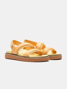 The favorite sandals of street-style? The ROAD PEACH, designed with Nappa leather straps to be the must-have of the season. Their molded insole, elevated rubber sole in pastel yellow, and slingback silhouette make them perfect for strolling through your favorite city, going to work, or a date with your friends. The contrasting embossed logo adds an elegant touch. Pair them with your favorite dress or denim for a casual-chic look. Style: Slingback sandals with two straps. Sole Height: 4.5 cm. Look Casual Chic, Premium Packaging, Ankle Boots Flat, Slingback Sandals, The Favorite, Pastel Yellow, Slingback Sandal, Favorite City, Velcro Straps