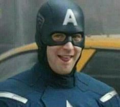 a man in a captain america costume is smiling