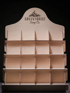 a wooden shelf with several compartments on it