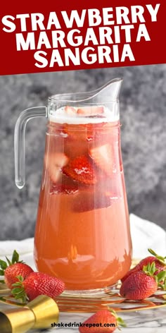 strawberry margarita sangria in a pitcher with strawberries