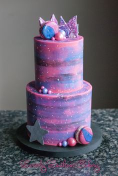 a purple and blue cake with stars on it