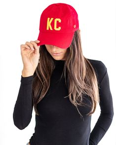 Put on your game face with our KC Cap in red and yellow. Featuring bold embroidery in chiefs colors, this cap is perfect for the ultimate fan. Go chiefs! Snap-back adjustable. Curved Visor Sports Fan Baseball Cap, Red Baseball Cap For Baseball Season, Red Baseball Cap For Sports Fans, Sports Fan Baseball Cap With Curved Bill, Curved Bill Baseball Cap For Sports Fans, Red Fitted Hat For Game Day, Baseball Season, Red Snapback Hat For Baseball Season, Red Fitted Hat For Baseball Season Game Day, Red Fitted Hat For Baseball Game Day