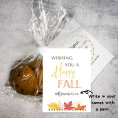 a bag of cookies sitting on top of a table next to a card and envelope