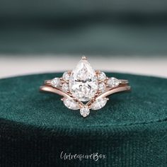 an engagement ring with two pear shaped diamonds