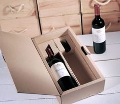 two bottles of wine in a cardboard box