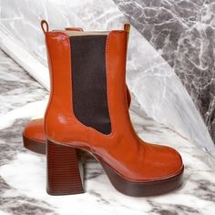 Add An Elevated Edge To Your Everyday Ensemble With The Effie Chelsea Boot. Heel Height: 3.75 Inches Platform Height: 1.1 Inches Round-Toe Pull-On Chelsea Booties Material: Synthetic Insole: Synthetic Orange Round Toe Boots For Fall, Orange Leather Boots For Spring, Trendy Orange Spring Boots, Red Stacked Heel Ankle Boots, Orange Boots With Reinforced Heel And Round Toe, Trendy Orange Leather Boots, Casual Ankle-high Patent Leather Platform Boots, Red Ankle Boots With Sculpted Heel, Circus By Sam Edelman Boots