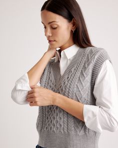 Stay cozy in our Australian Merino Wool Cable Sweater Vest. It's got the soft, smooth, temperature-regulating warmth you love in a soft, chunky cable knit. Makes a classic statement on its own, and wears just as well layered over a crisp white button down.  | Quince | Women's Australian Merino Wool Cable Sweater Vest in Heather Grey, Size XS Cozy Textured Knit Sweater Vest For Fall, Winter Cable Knit Cozy Top, Winter Chunky Knit Sweater Vest For Layering, Chunky Knit Sweater Vest For Winter, Cozy Knitted Sweater Vest, Cozy Textured Knit Sweater Vest For Layering, Cozy Textured Knit Sweater Vest, Cozy Gray Cable Knit Sweater, Cozy Fit Cable Knit Tops For Winter