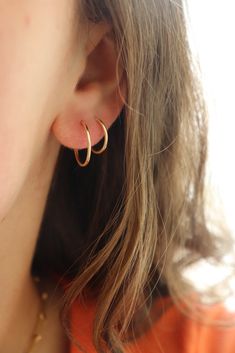 These sweet and delicate little hoops are the newest addition to our earring collection. Simple + effortless, our Goldie Hoops are a favorite for everyday style. MEASUREMENTS Available in 14k Gold Fill or Sterling Silver in 10mm, 14mm, or 16mm diameter14k Rose Gold Fill available in 16mm diameterChoose between a single earring or a pair. Dainty Small Hoop Huggie Earrings For Everyday Use, Dainty Everyday Small Hoop Huggie Earrings, Simple 14k Gold Huggie Earrings For Everyday, Simple Everyday 14k Gold Huggie Earrings, Everyday Simple 14k Gold Huggie Earrings, Simple 14k Gold Huggie Hoop Earrings, Classic Everyday Hypoallergenic Cartilage Earrings, Classic Small Hoop Cartilage Earrings For Everyday, Tiny Classic Hoop Earrings