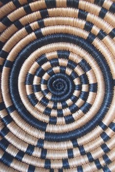 a close up view of a basket with black and white designs on it's sides