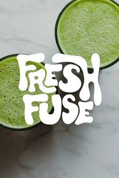 two glasses filled with green juice and the words fresh fuse written in white letters