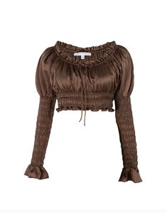 Product Description: Victorian Silk smocking blouse with juliet sleeves and adjustable neck strings with beaded ends. Fabric: 100% Silk Color: Dark Brown Size and Fit: Our model is 5'10" and is wearing a size XS. Care Instructions: Cold Hand Wash or Dry clean Party Brown Silk Tops, Fall Silk Top With Gathered Sleeves, Elegant Brown Silk Blouse, Luxury Brown Silk Top, Brown Long Sleeve Top With Ruched Detail, Secret Mission, Knit Loungewear, Stocking Fillers For Him, Stocking Fillers For Her