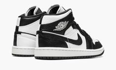 The Women’s Air Jordan 1 Mid “Split Black and White” is a women’s-exclusive colorway with a mismatched design.  As its name implies, the “Split Black and White” Jordan 1 Mid features a split appearance that inverses the shoe’s black-and-white color block on each side.  The lateral side of the shoe features a white tumbled leather base with contrasting black leather overlays and Swoosh branding.  The medial side reverses the color block, with a black leather base with white leather overlays and S Ying Yang Jordan 1, Womens Black And White Jordans, Jordan 1 Mid Split, Womens Air Jordan 1, White Jordan 1, Black And White Jordans, Womens Air Jordan, Latest Jordans, Jordans 1