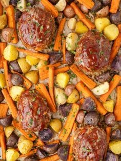 meatballs, potatoes and carrots on a baking sheet