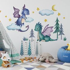 a child's room decorated with wall decals and toys