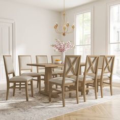 a dining room table with chairs and a chandelier