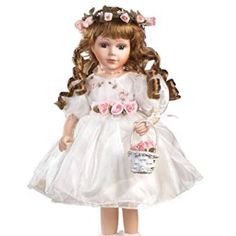 a doll is dressed in white and holding a basket with pink flowers on her head