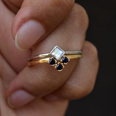 "Flashy rainbow moonstone set in 14k white gold and lovely blue sapphire, set in 14k rose gold, this stunning wedding set is a perfect one for the two of you - similar, yet so different! It can be personalized with birthstones. Please convo MOONSTONE RING: * Stone : Natural Rainbow Moonstone * Stone Wt. : 0.18 Cts * Gold - 14kt, 1.1 g solid white gold BLUE SAPPHIRE V BAND: * Stone : Natural Blue Sapphire (Treated) * Stone Wt : 0.21 Cts * Gold - 14kt, 1.2g solid rose gold Other Wedding Sets you m Elegant Stackable Sapphire Rings With Rose Cut Diamonds, Modern Multi-stone Wedding Jewelry, Stackable Moonstone Wedding Ring, Sapphire Stackable Rings In 14k Gold For Wedding, Sapphire Stackable 14k Gold Rings For Wedding, Sapphire Stackable Wedding Rings In 14k Gold, Sapphire Jewelry With Rose Cut Diamonds For Wedding, Stackable 14k Gold Rings For Wedding, Modern Stackable Sapphire Wedding Ring