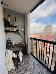 a balcony with a desk and shelves on it