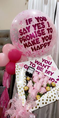 balloons, flowers and greetings are on display at a party for someone's special occasion